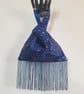 Blue sequin Japanese Knot bag with 14cm tassel trim and satin lining.