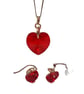 Necklace and earrings set with red heart shaped Swarovski crystals