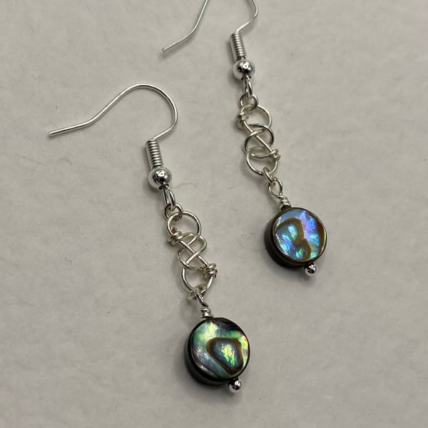 Wirework infinity symbol earrings with circular paua shell charms