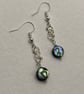 Wirework infinity symbol earrings with circular paua shell charms - Image 1