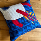 Square quilted floor cushion with space rocket