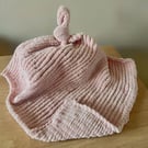 Pink hand-knitted comforter blanket  