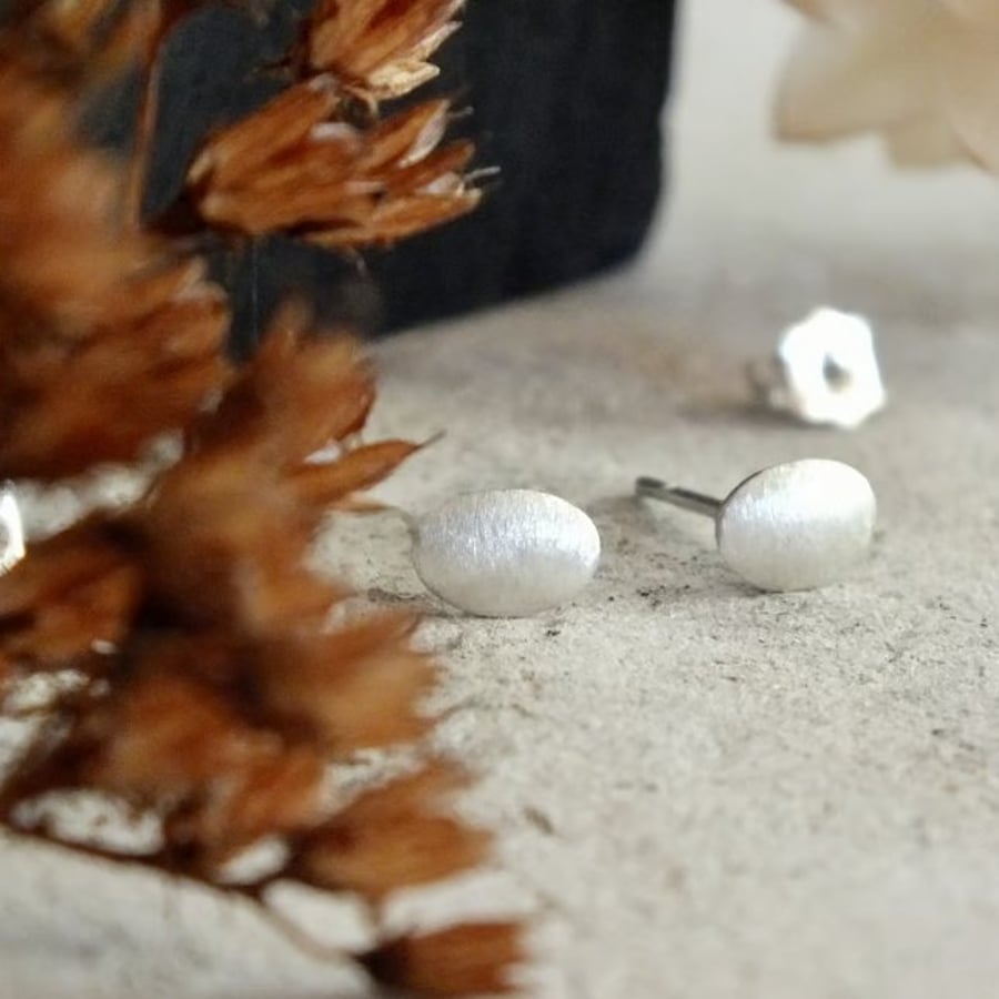 Brushed sterling silver oval stud earrings; minimal everyday studs