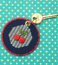 Cherry Cross Stitch round Keyring with Button Faces - Image 5