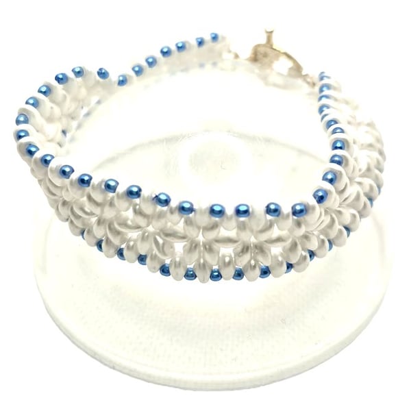 Ladies white beaded bracelet with blue faux pearls