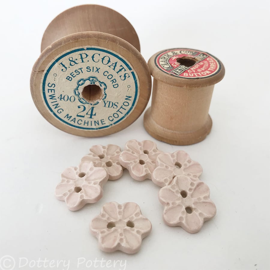 Set of six pale pink flower shaped ceramic handmade buttons