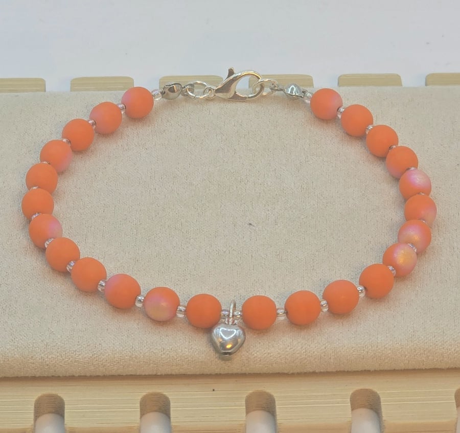 Orange Czech glass bracelet with a silver heart charm 