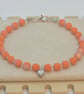 Orange Czech glass bracelet with a silver heart charm  - Image 1