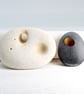 Pebble brooch with gilded hole that goes through the stone. Nature inspired. - Image 3