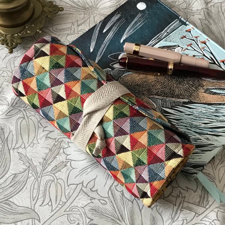 Tristan:  Tapestry 7-slot fountain pen roll with linen twill tie.          
