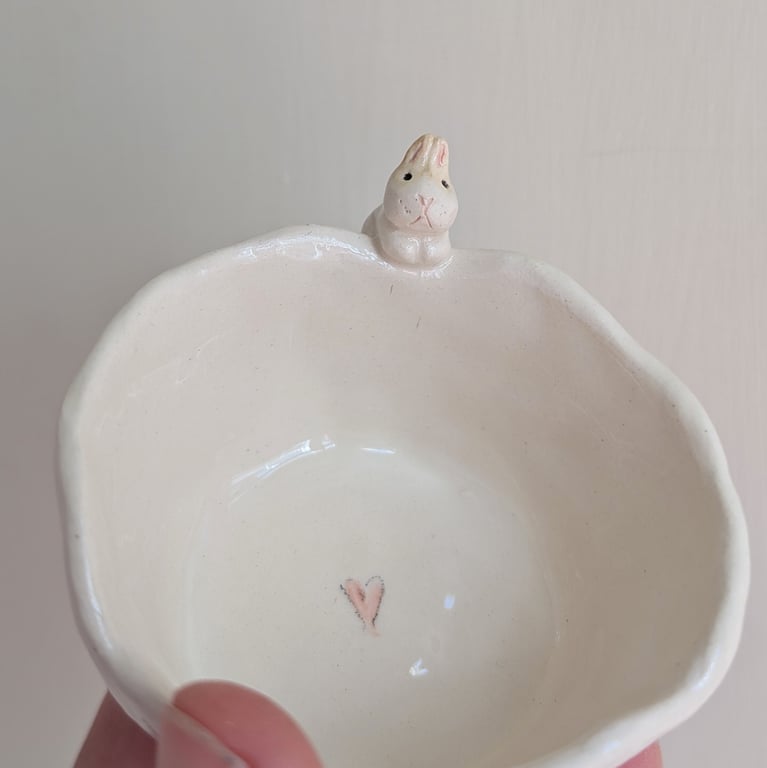 Ceramic tealight wth white bunny hearts and paw prints, rabbit candle holder