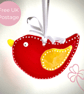 Red and Yellow Winged Glass Bird Hanging Decoration - Image 1