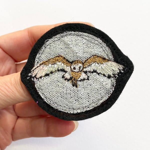 Upcycled flying barn owl brooch pin or badge.