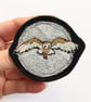 Upcycled flying barn owl brooch pin or badge.