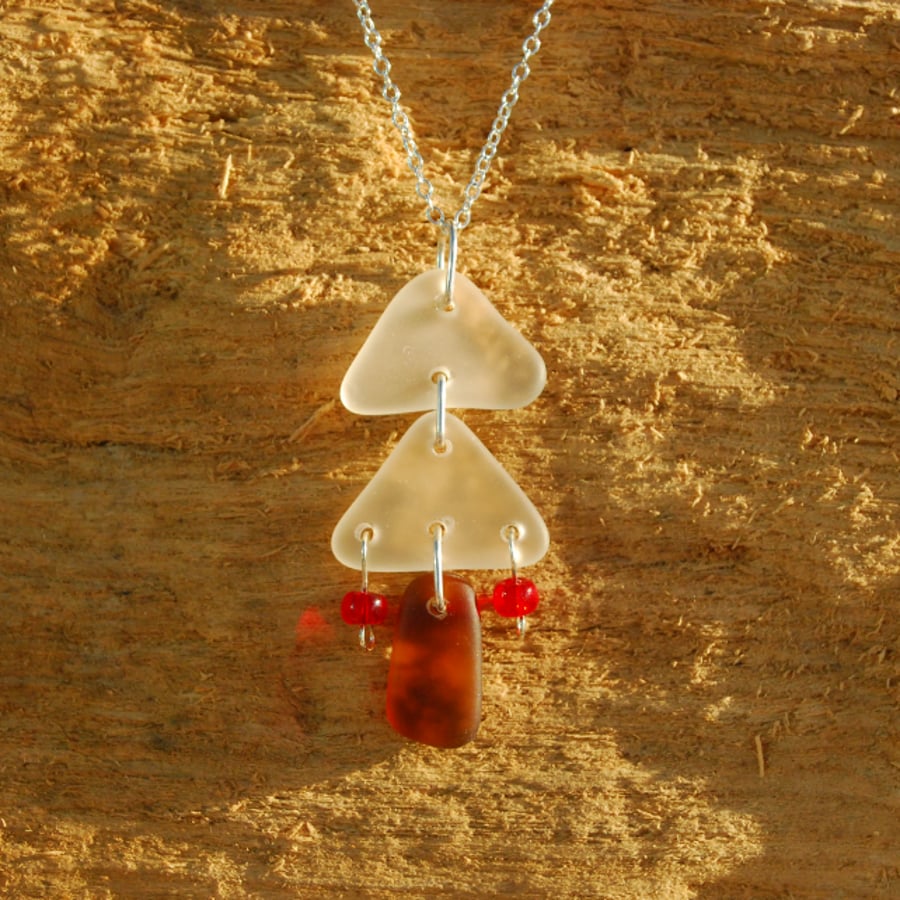 White beach glass Christmas tree with red baubles