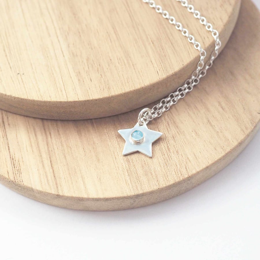 Silver Star Pendant with March Birthstone Blue Topaz