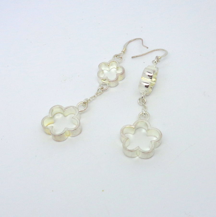 Silver flower shaped drop earrings on sterling silver hooks