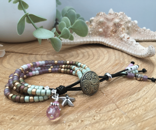 Pretty 4 strand beaded leather boho style beaded charm bracelet 