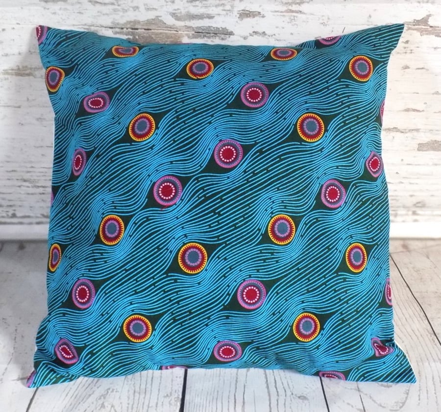 Cushion cover. African wax print, multicolour circles on teal and turquoise