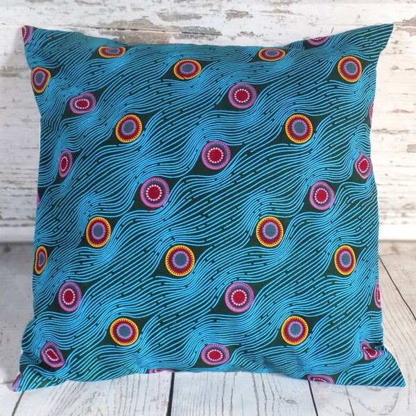 Cushion cover. African wax print, multicolour circles on teal and turquoise