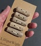 Five chunky driftwood toggle buttons