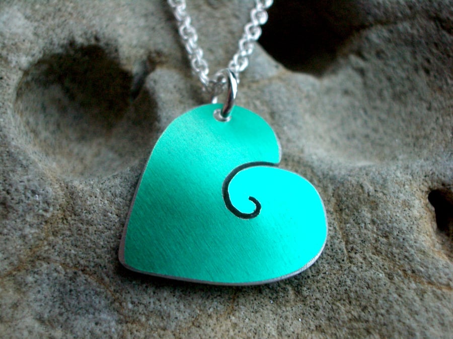 Heart pendant with spiral in green