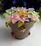 Tropical Flowers in a Pot - Image 1