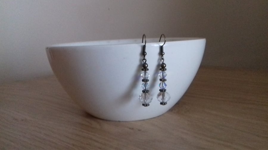 AB FACETED CRYSTAL AND ANTIQUE BRONZE EARRINGS.
