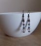 AB FACETED CRYSTAL AND ANTIQUE BRONZE EARRINGS. - Image 1