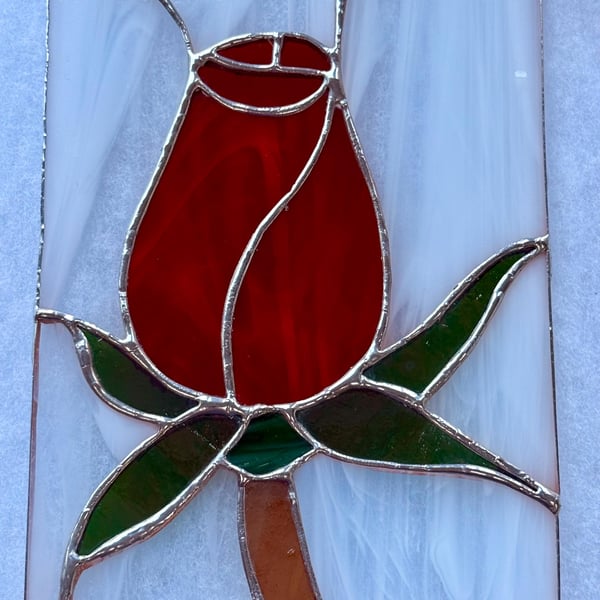 Stained glass red rose on white background
