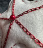 A Red and white star tree decorations with metallic thread and seed beads  - Image 7