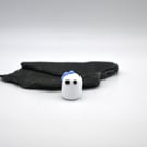 small glass ghost with blue bow
