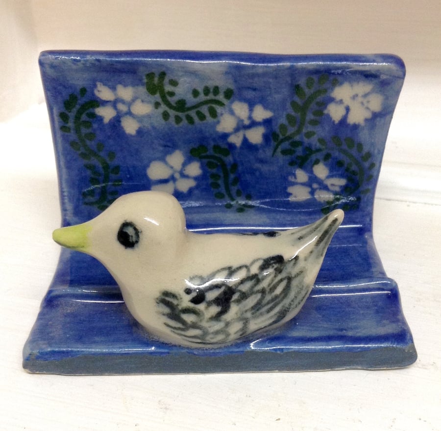 Business card holder with bird decoration