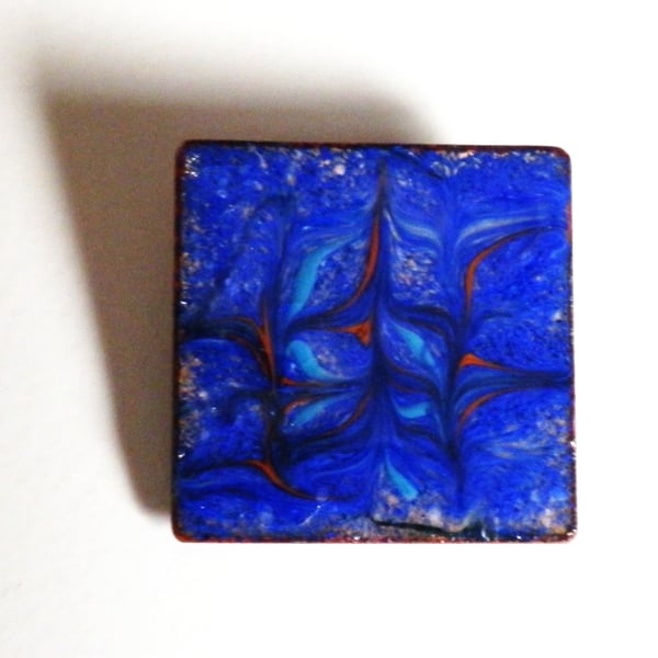 brooch - square: scrolled dark blue, turquoise and red, over clear enamel