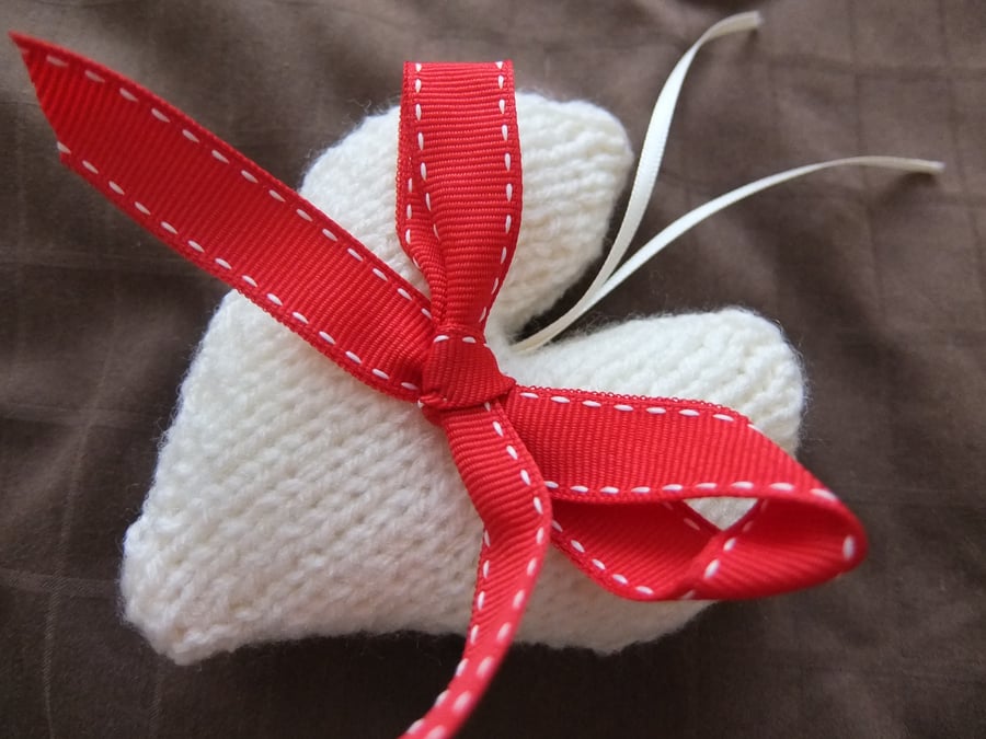 Cream hand knitted heart with a red bow, knitted heart Christmas tree decoration