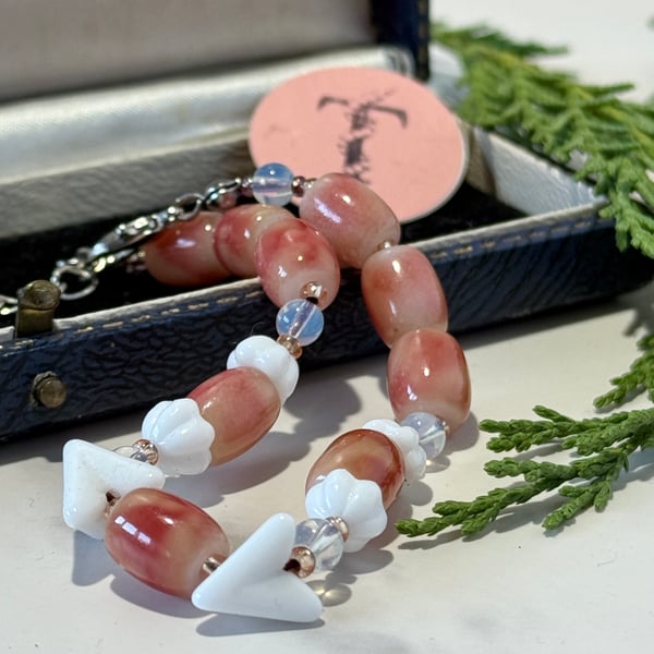 Vintage glass bead bracelet in pink and white.
