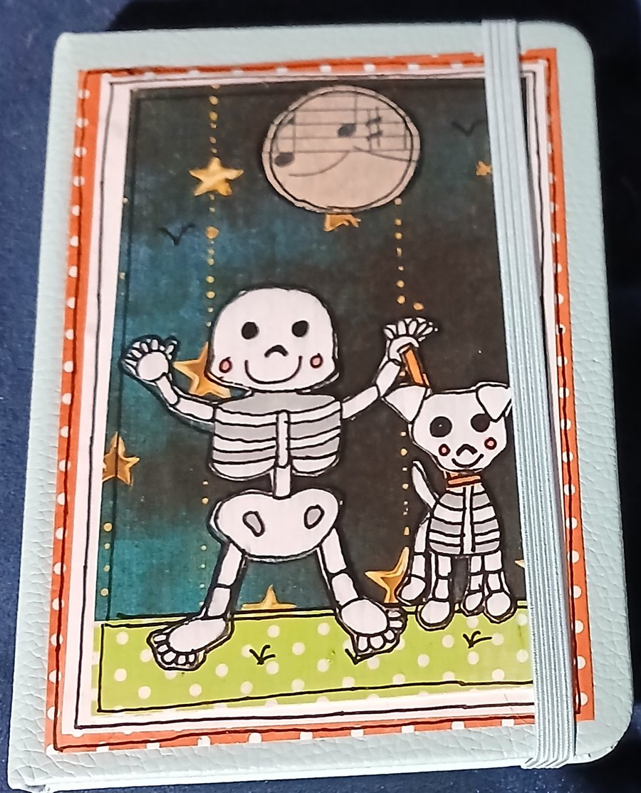 Quirky halloween A6 lined hand decorated notebook with cute skeleton and his dog