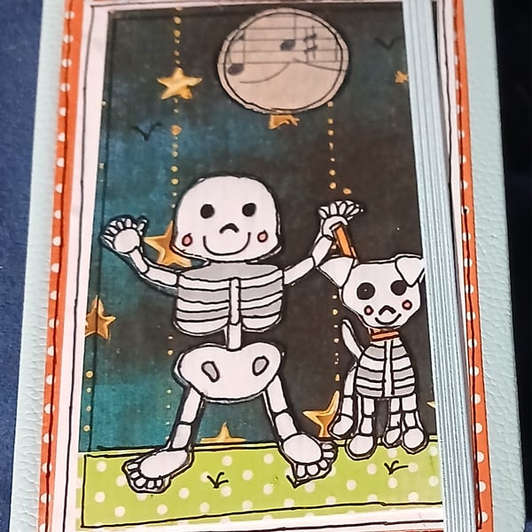 Quirky halloween A6 lined hand decorated notebook with cute skeleton and his dog