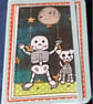 Quirky halloween A6 lined hand decorated notebook with cute skeleton and his dog
