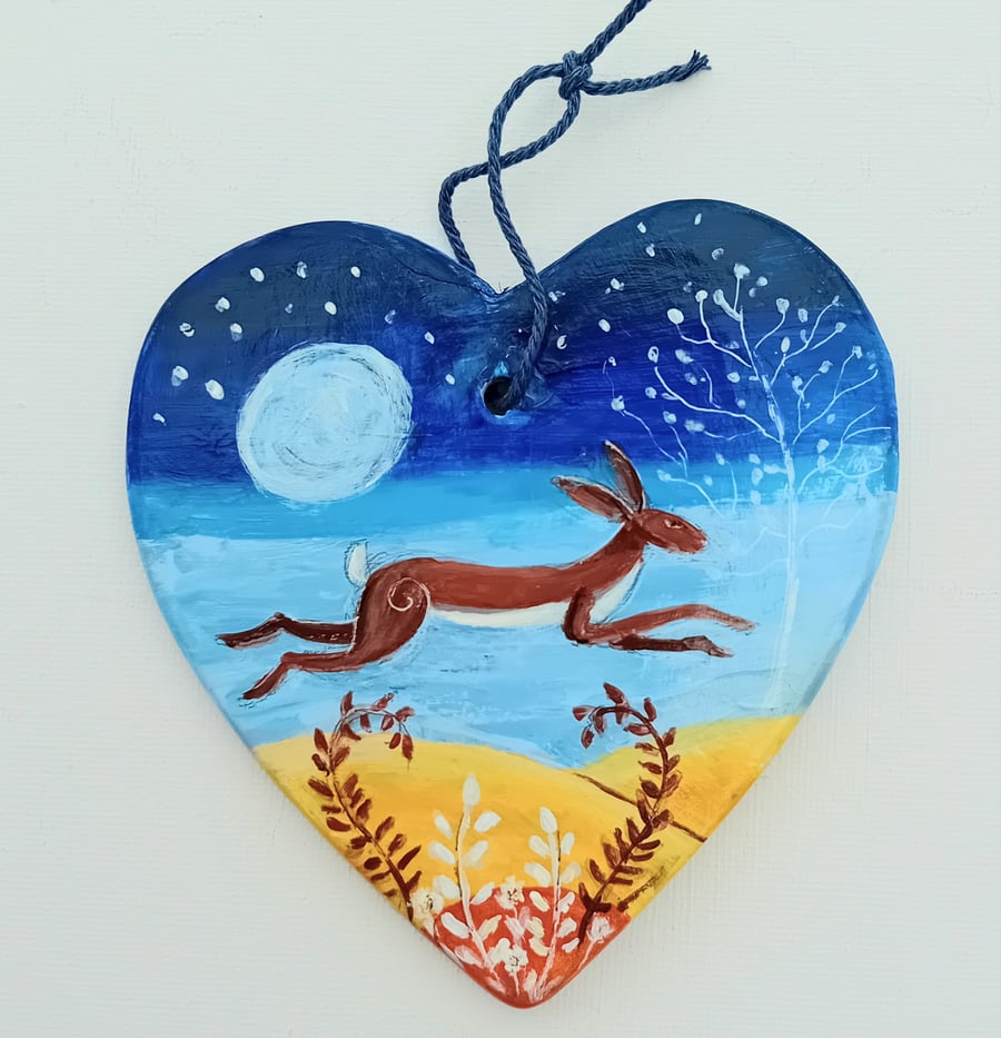 Leaping hare on ceramic heart