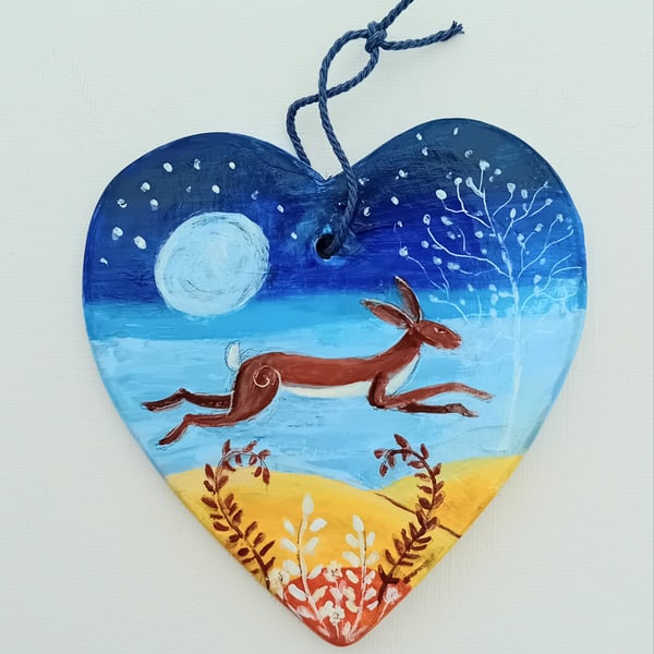 Leaping hare on ceramic heart