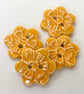 Set of four little handmade ceramic flower buttons orange