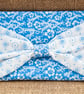 Padded Pouch with Bow in Blue for Mobile Make-Up Credit Card Tissues - Image 1