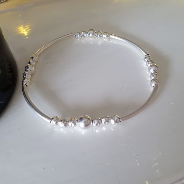 Silver tube bead bracelet. Sterling Silver Noodle Bracelet. Elasticated bracelet