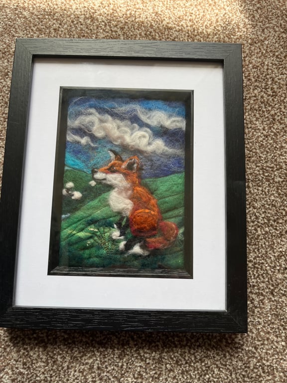 Red fox on a hill watching sheep Needle felt black frame 
