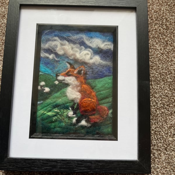Red fox on a hill watching sheep Needle felt black frame 