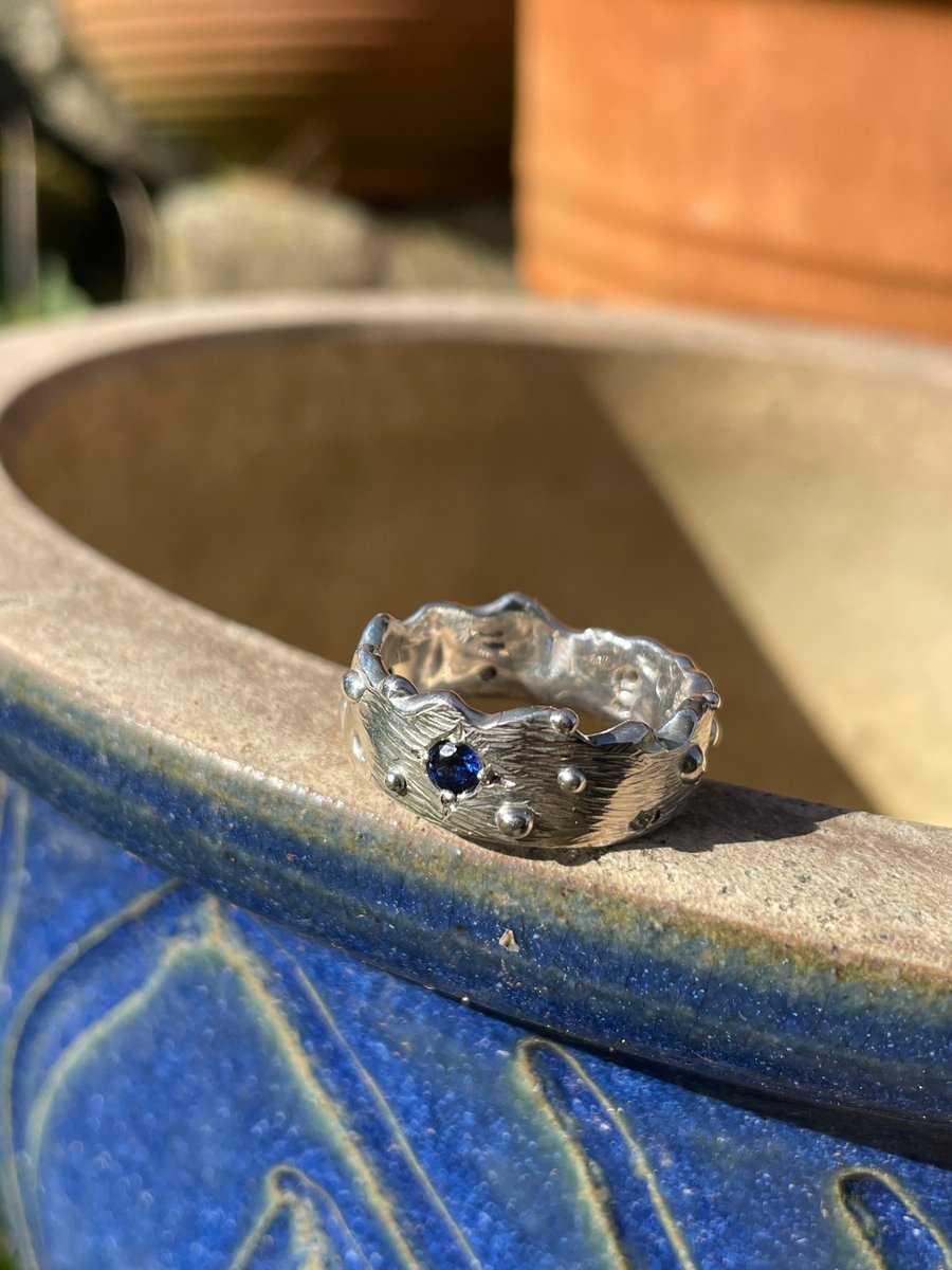 Handmade silver ring with blue CZ, textured band, size P