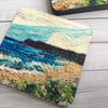 Seascape coaster or drinks mat. 