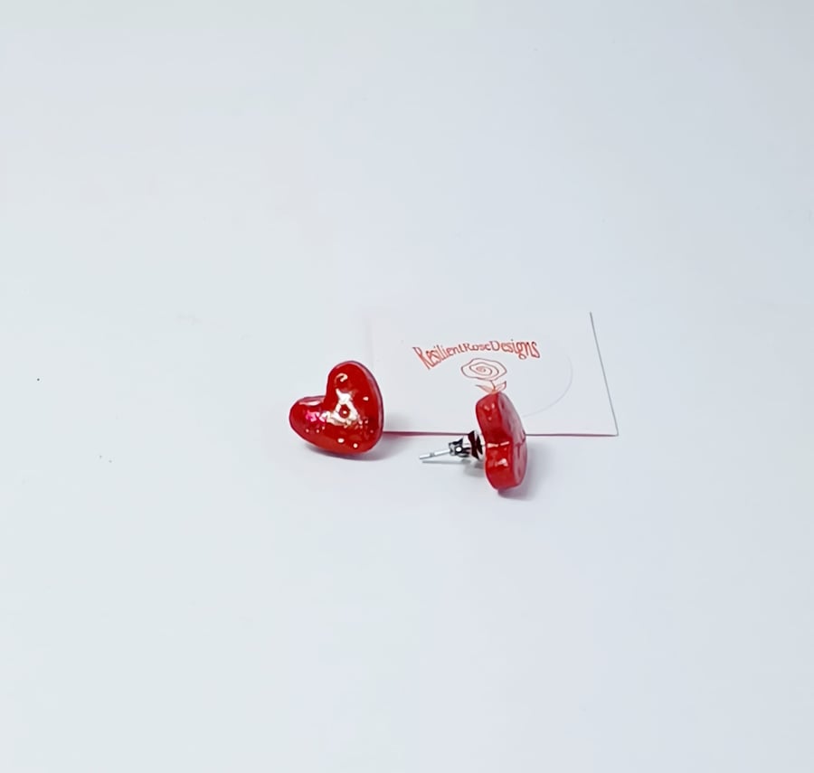 Heart shaped red sparkle studs