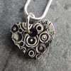 Heart shaped ceramic pendant in black white and grey 